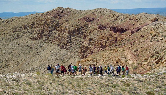 MeteorCrater-GuidedRimTour_Courtesy_680 People taking the Guided Rim Tour at the Meteor Crater east of Flagstaff, AZ. Courtesy photo