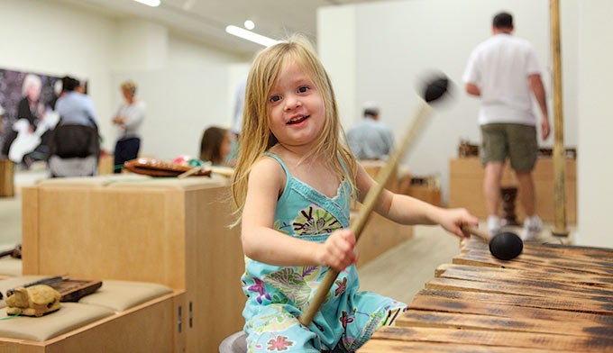 AZ-kid-instrument_courtesyMIM_680 A child playing a Xylophone at the Musical Instrument Museum. Courtesy photo