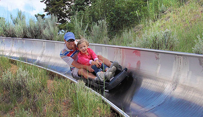 Alpine-slide_editorialonly_courtesyUtahOlympicLegacyFoundation_680 A father and daughter ride the alpine slide at Utah Olympic Park. Photo courtesy of Utah Olympic Legacy Foundation