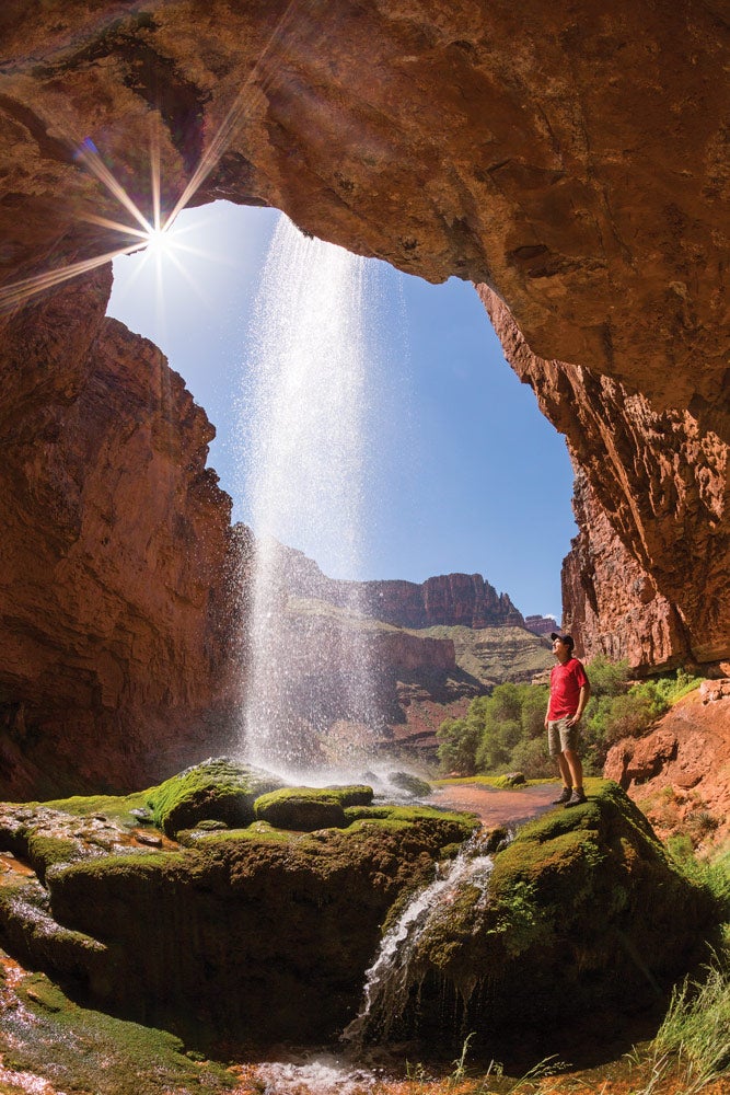 GC-RibbonFalls_Ordelheide_1000 Hiker at Rainbow Falls in the Grand Canyon. Photo by Grant Ordelheide