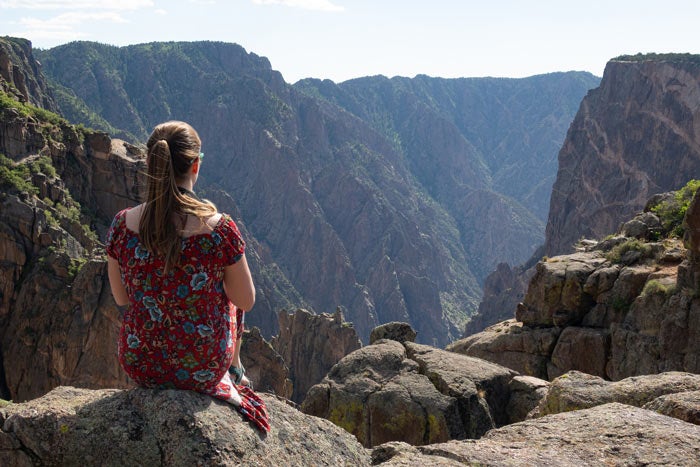 BlkCanyon-MikaelaAtPaintedWall_TopherYanagihara_700 Enjoying the view at Painted Wall in Black Canyon of the Gunnison National Park