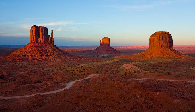 Monument-Valley-mittens-sunset_DP_680 From the hotel rooms of The View, guests overlook the Mitten buttes of Monument Valley