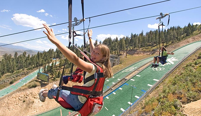 UT-OlympicPark-zipline_MarkMaziarz_courtesyParkCity_680 Kids riding the zipline at Utah Olympic Park in Park City